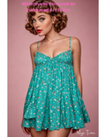 Woman wearing a teal floral dress against a pink background with nude version 2 included